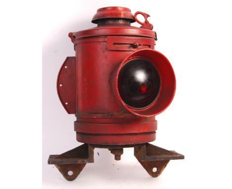 An original vintage mid 20th century steam train locomotive railway interest level crossing signal warning lamp having a red 