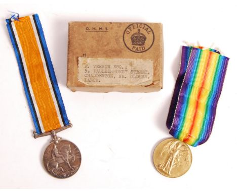 A WWI First World War medal pair awarded to a 48290 Private F. Vernon of the Manchester Regiment. War medal and Victory Medal