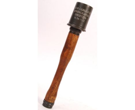 A WWII Second World War style German practice stick grenade (non-functioning). Various stamps and markings to the upper metal