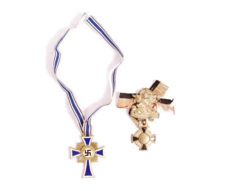 A reproduction WWII second World War German Nazi Third Reich Mothers Cross with blue , white and black enamelling with blue a