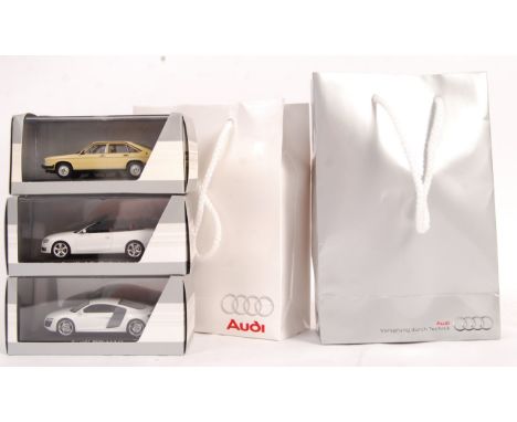 A set of three exclusive Paul's Model Art Minichamps 1/43 scale diecast model Audi Collection promotional advertising give aw