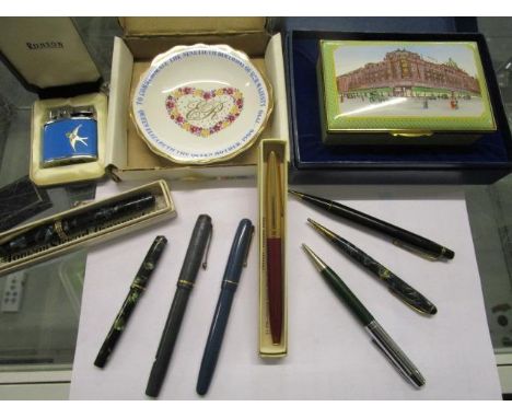 A group of Conway Stewart and other fountain pens and pencils to include 'The Dinkie', a boxed Harrods enamel box, a Ronson l