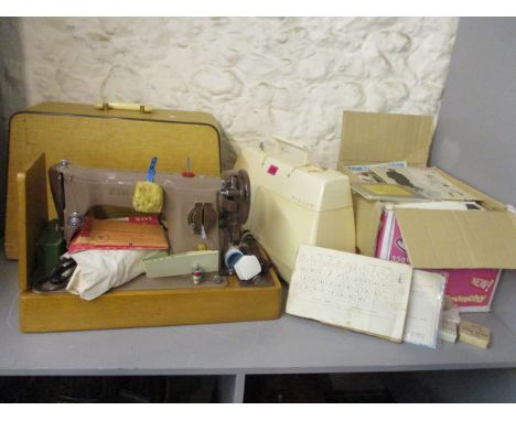 A Singer sewing machine with instructions leaflet, a Singer Starlet sewing machine and box of Vogue American designer sewing 