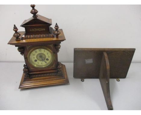 A late 19th century German walnut clock with turned finials and gong strike movement and an associated oak bracket 