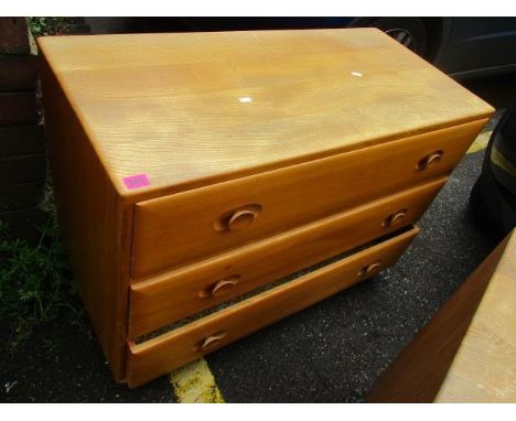 An Ercol chest of three long drawers, 26h" x 36"w 