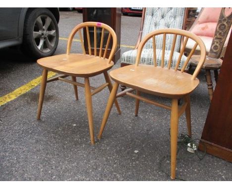 A pair of Ercol dressing chairs 