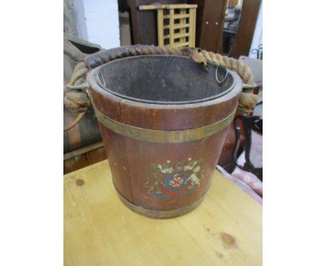 A mid 20th century coopered coal bucket with a rope and leather handle, decorated with a coat of arms 