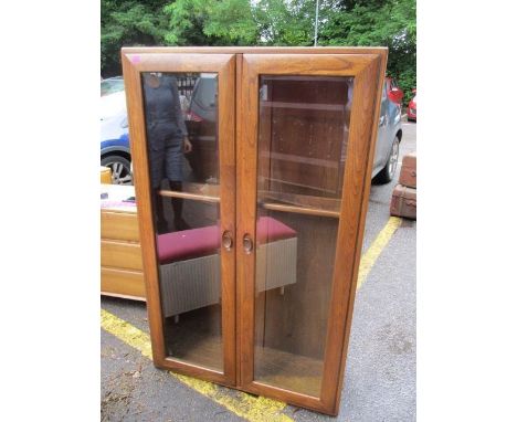 An Ercol two door glazed bookcase, 57 1/2"h x 36"w 