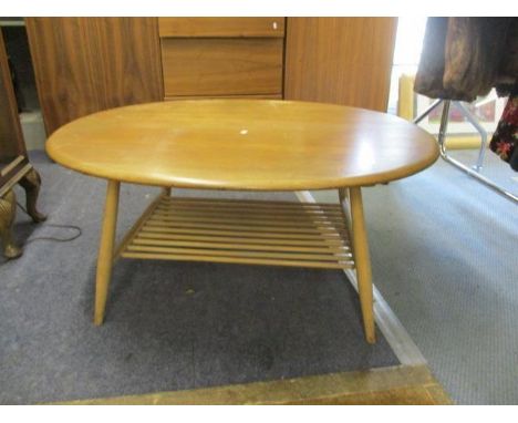 An Ercol, elm and ash two tier coffee table, 17 1/2" h x 39"w 