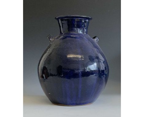 A large blue glaze Trevor Corser urn shaped vase with twin handles, height 29cm, impressed Leach Pottery, St Ives marks and p