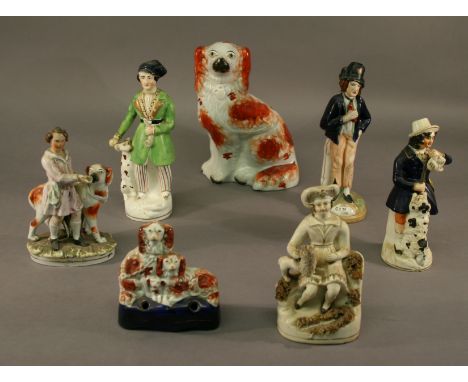 A GROUP OF SEVEN STAFFORDSHIRE FIGURES including the unusual Gin Water example, a hunter and seated dog. (7) CONDITION: GIN/W