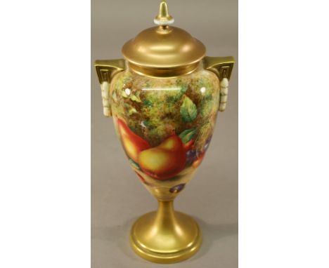 A ROYAL WORCESTER LIDDED VASE having a domed finial topped cover, ovoid body with Greek key and swag handles, painted with fr