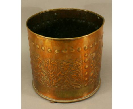 A KESWICK SCHOOL OF INDUSTRIAL ART (KSIA) CYLINDRICAL COPPER PLANTER with panels of foliate repoussé decoration, marked to ba