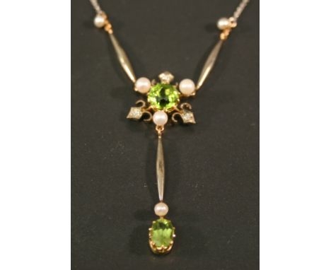 A PERIDOT, PEARL AND DIAMOND SET WHITE AND YELLOW METAL NECKLACE, the central round-cut peridot in a pearl and small diamond 