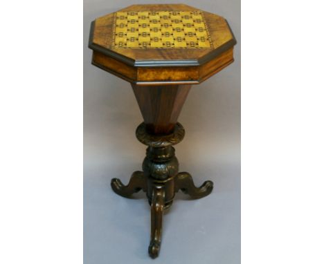 A VICTORIAN WALNUT PEDESTAL WORK TABLE having a hinged octagonal top with inlaid chequer board and lined, sectioned interior 