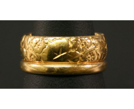 TWO 22CT GOLD BANDS the larger with foliate moulding, both marked 22, ring sizes K-L & M. 9grams(total) CONDITION: Generally 