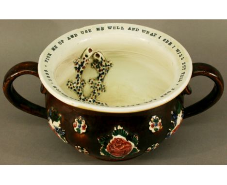 A VICTORIAN BARGEWARE CHAMBER POT of circular form with two scroll handles, the interior decorated with two salamanders, the 