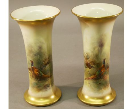 A PAIR OF ROYAL WORCESTER HAND-DECORATED VASES of flared cylindrical form, decorated with pheasants and signed 'Jas Stinton' 