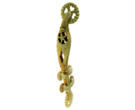 A 20TH CENTURY ELABORATELY CARVED AND TURNED BONE PASTRY JIGGER of New England whaler type, the two main jigging wheels each 