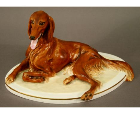 A ROYAL WORCESTER 'RED SETTER' FIGURE modelled recumbent, limited edition number 94 of 250. 30cm(w) CONDITION: Lacking plinth