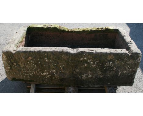 A LARGE SANDSTONE TROUGH formally situated at the Woodside Estate, Wreay. 50cm(h) x 160cm(w) x 79cm(d) CONDITION: Some weathe