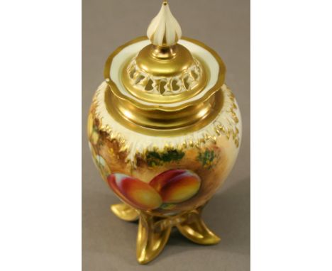 A ROYAL WORCESTER LIDDED POT POURRI VASE having a pierced finial topped cover and ovoid body decorated with fruit, signed Rob