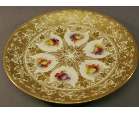 A ROYAL WORCESTER FOR TIFFANY & CO (NEW YORK) PLATE decorated with six panels of fruit within a profuse gilt decorated framew