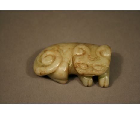 A CHINESE CARVED JADE TIGER recumbent with coiled tail. 7cm(L) CONDITION: Good condition