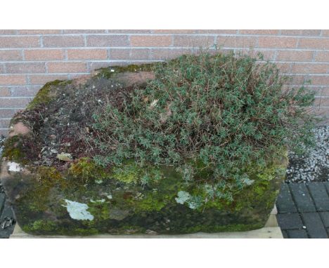 A LARGE RED SANDSTONE TROUGH of rectangular form. 48cm(h) x 102cm(w) x 77cm(d) *** This trough is believed to originate from 