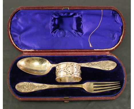 A VICTORIAN CASED SILVER CHRISTENING SET, a napkin ring, spoon and fork, each with stylised decoration and engraved initials 