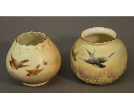 TWO ROYAL WORCESTER BLUSH IVORY GLOBULAR VASES shape numbers 1041 &1042, painted with birds against a blush ground. 6.5cm & 7