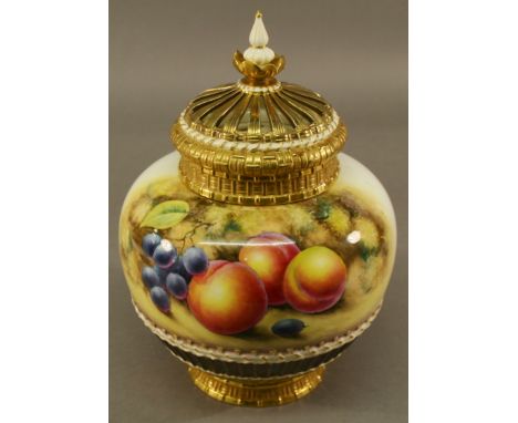 A ROYAL WORCESTER HAND-DECORATED POT POURRI VASE AND COVER having a finial topped lattice cover, inner lid and globular body,