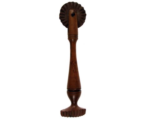 TWO 19TH CENTURY TURNED WOODEN PASTRY JIGGERS one with bone wheel, the other unusual in having an arced cutter. 12.5cm & 14.2
