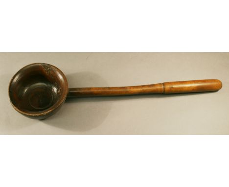 A 19TH CENTURY TREEN LADLE, turned sycamore bowl and handle. 43cm(L) CONDITION: Some cracking to bowl due to natural flaws