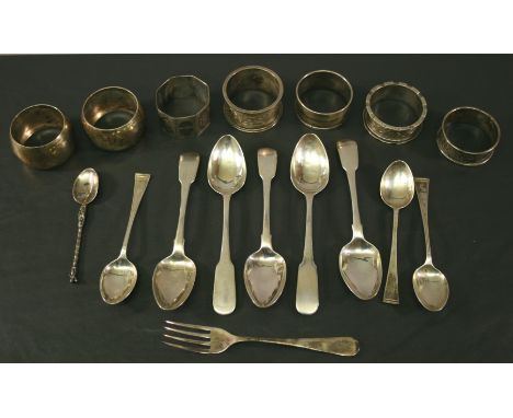 A GROUP OF MISCELLANEOUS SILVER ITEMS, spoons, napkin rings and fork, various ages, designs and makers. (qty) 290grams(total)