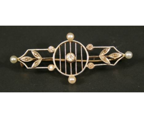 A YELLOW AND WHITE METAL DIAMOND AND PEARL-SET BROOCH, the central small diamond brilliant set within a ring of pearls and sm