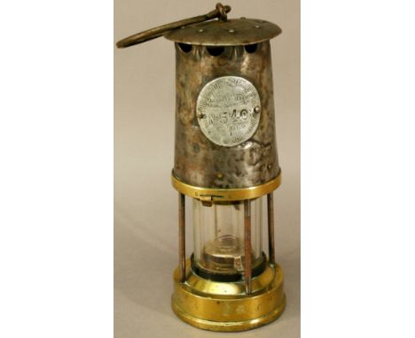 A STEEL BONNET MINERS' SAFETY LAMP, Number 540 Protector Lamp Light Co. "Approved under lighting schedule A33", Eccles, Manch