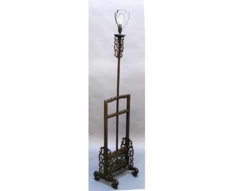 A CHINESE HARDWOOD STANDARD LAMP the central support with scrolled decoration over a rectangular structure housing the adjust