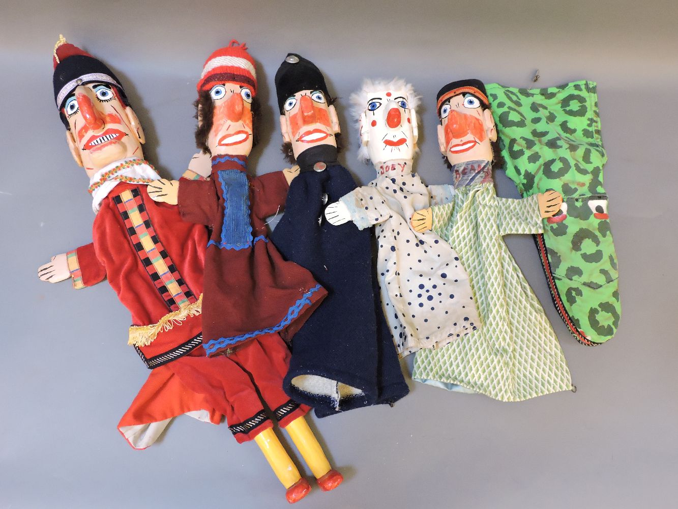 Six painted wooden Punch and Judy puppets, comprising Mr Punch, Judy