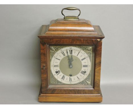 An 18th century style walnut bracket clock, with three train movement, with Westminster chimes, chiming the quarters