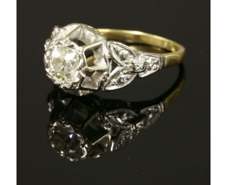 An Edwardian single stone diamond ring, with a cushion cut diamond, estimated as approximately 0.80ct, illusion set to a star