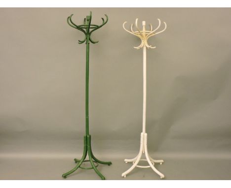 Two painted hat stands, a cast iron umbrella stand and a stick stand