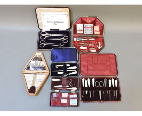 Five cases of sewing tools, one with mother of pearl handles, 'The Marion Needle Case', and one with four pairs of silver han