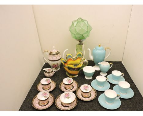 A 1930s 'Uranium' figural lamp, two coffee sets, one Wedgwood, and a coloured glass vase