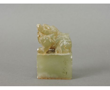 A Chinese celadon jade seal, 2.5cm high