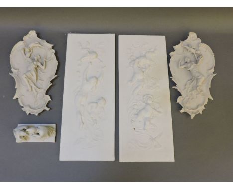 A pair of plaster plaques, 48cm high, a pair of resin plaques, 33cm high, and a bisque porcelain figure, 'Leda and The Swan',