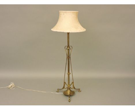 An Art Nouveau brass standard lamp