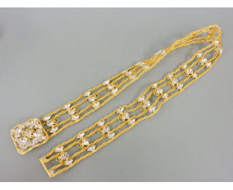 A gold plated paste belt, circa 1960, by Kenneth J Lane, from the 'Grace' collection, four rows of twisted chain with sets of