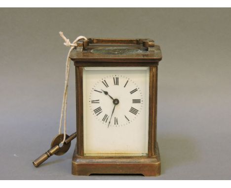 A brass carriage clock, 11.5cm high