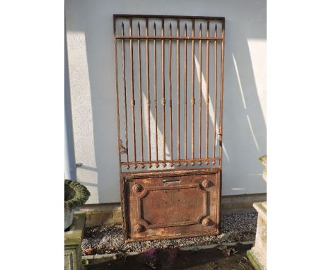 A French cast iron gate, with grilles over a panel cut with a postbox slit, 206cm high, 94cm wide